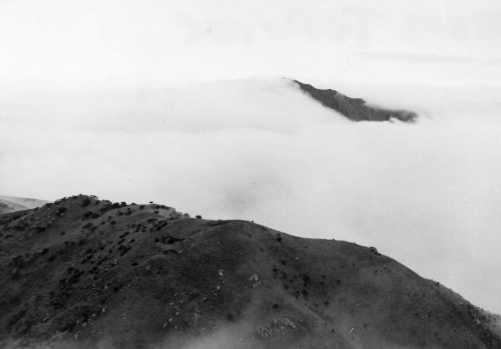 Land of Morning Calm. Fog covers all except mountain peaks